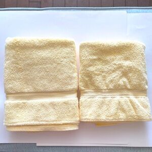 Two Non-Matching Soft Yellow Bath Towels Look Similar